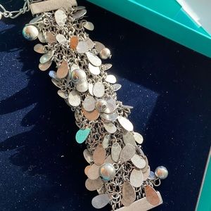 Silver bracelet with accent stones and brilliant design . New